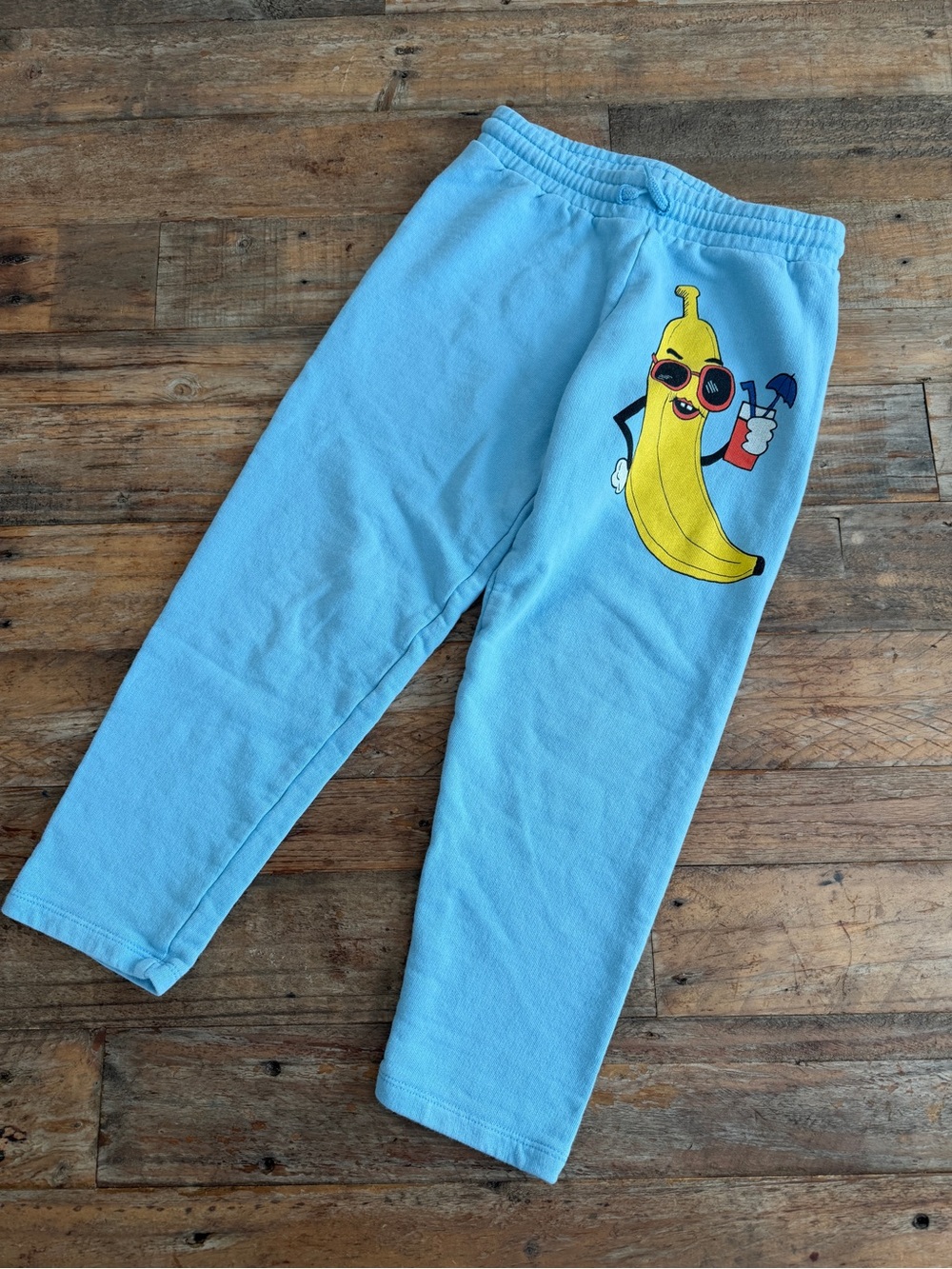 Mini Rodini Light Blue Sweatpants with Yellow Banana Graphic
